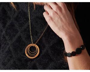 Madera Design Studio's Circles Necklace Versatile, bold, statement necklace. 18K gold plated hypoallergenic 24" chain. Wood and gold pendant